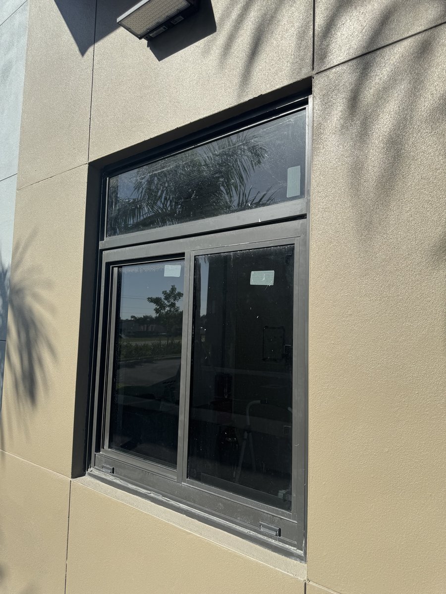 Commercial storefront window cleaning, exterior and transom glass on a Cape Coral office building